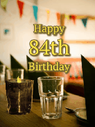 Happy Birthday Age 84 GIF, 84th Birthday GIF: Fancy birthday gif of a bar with a flickering candle, falling confetti, and peronalized text.