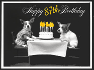Happy Birthday Age 87 GIF, 87th Birthday GIF: Vintage animated birthday card gif with name, flickering candles, birthday cake, and 2 dogs sitting at the table.