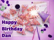 Happy Birthday Dan GIF: A big paper sparkle highlights this animated birthday gif showing a birthday cake place setting with decorations.