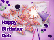 Happy Birthday Deb GIF: A big paper sparkle highlights this animated birthday gif showing a birthday cake place setting with decorations.