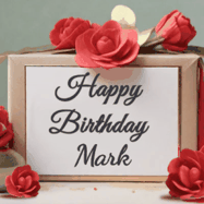 Happy Birthday Mark GIF: An elegant gift box label animated gif with glitter flowing over the label and a name appearing that you can customize. The scene is decorated with roses
